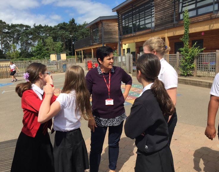 Diane Grano with a group of children